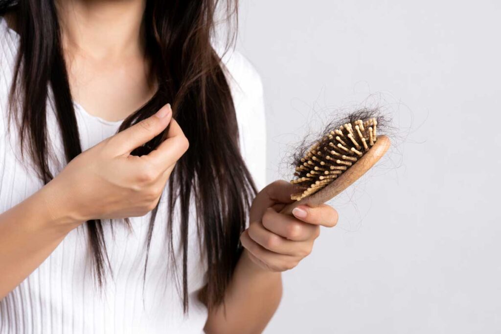 Female hair loss Woman with brush
